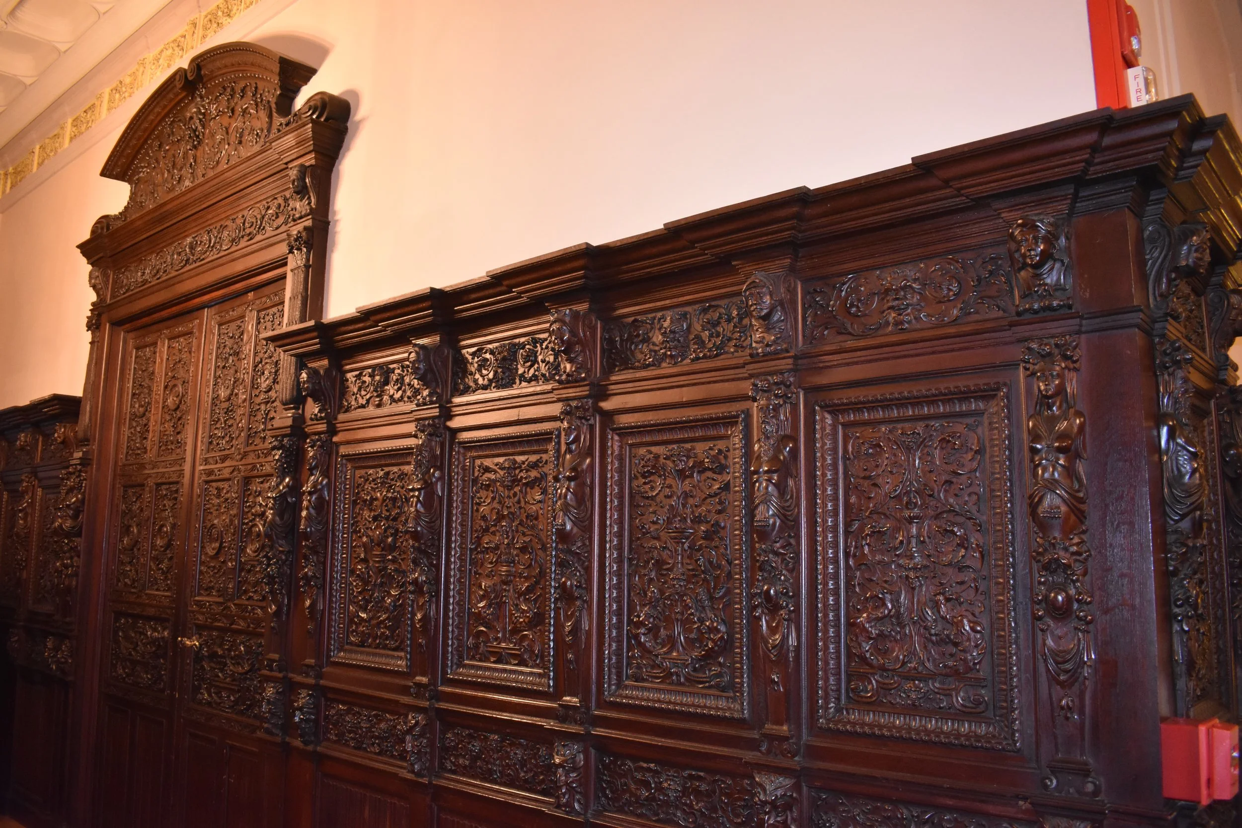 Hand-carved wood panels remain from the earliest days of the house. Photo by Diplomatica Global Media.