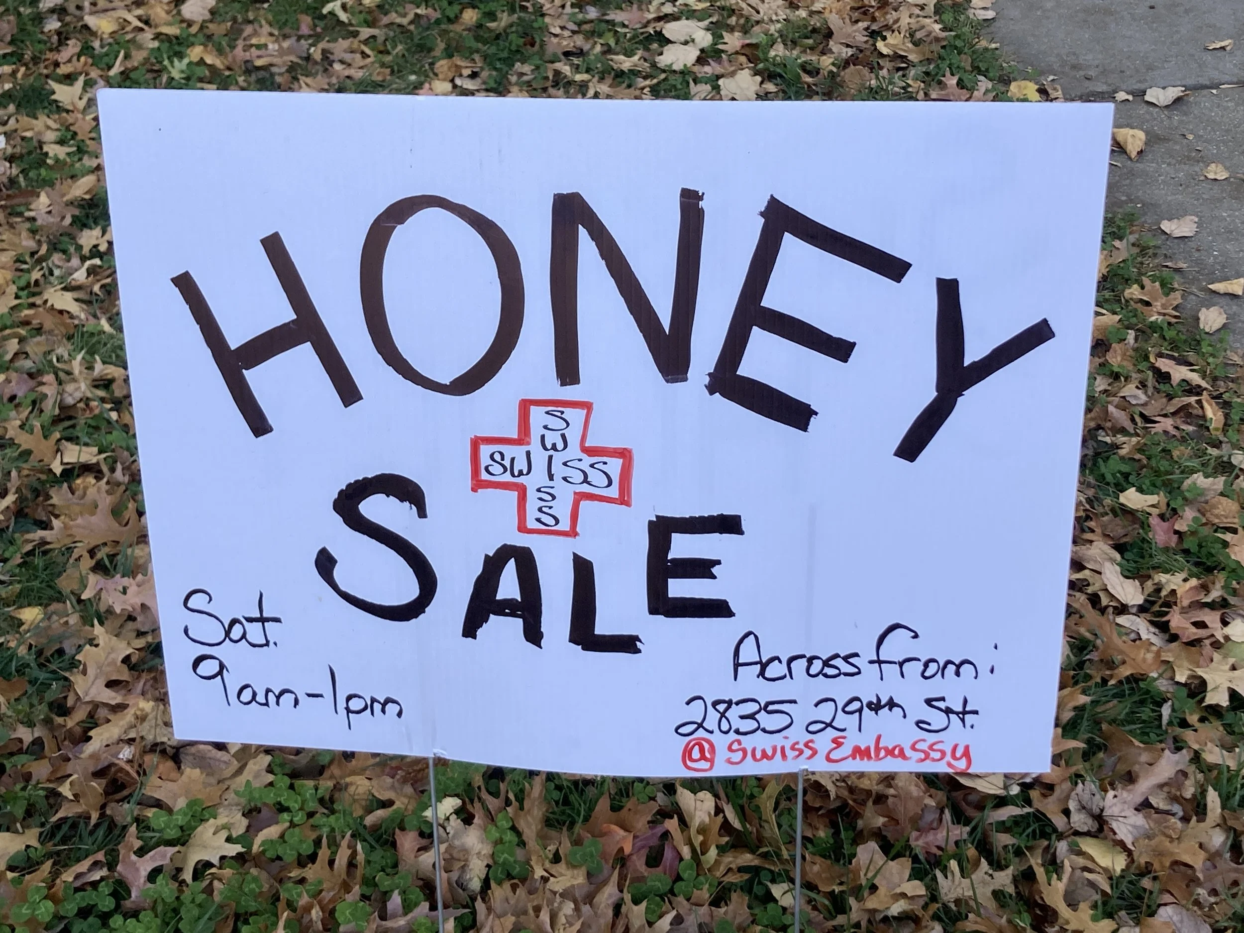 A neighborhood sign alerts locals to the annual honey sale. Photo by Diplomatica Global Media.