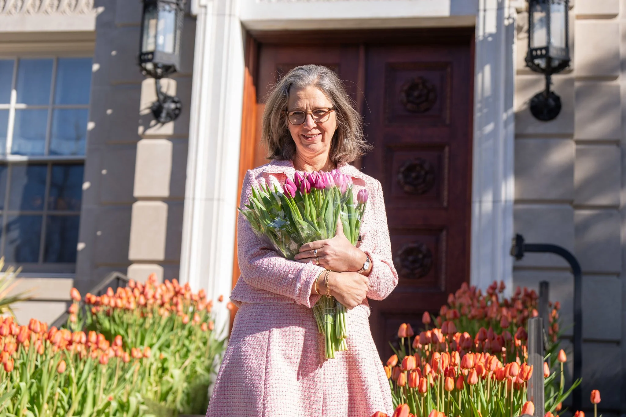 Visitors to Tulips Days were gifted bouquets, like these held here by Dutch Ambassador Birgitta Tazelaar . Photo courtesy of the embassy.