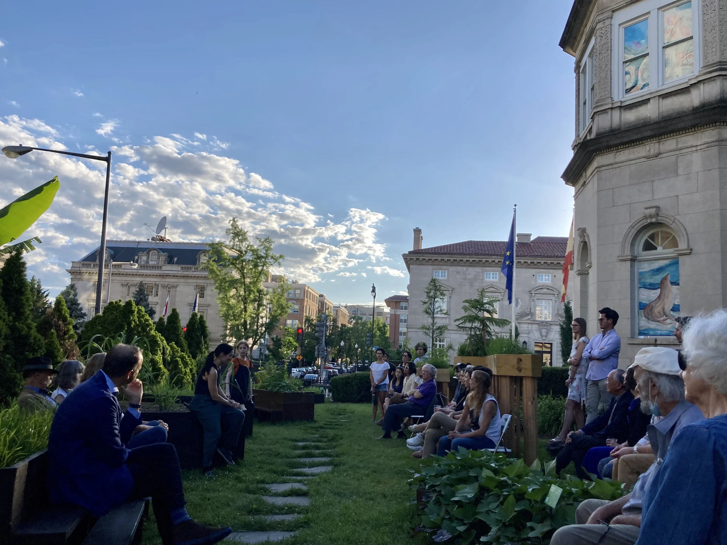 Actors recite works of Spanish playwrights during the pandemic, in a garden staged for the Magellan exhibition, beneath windows covered with illustrations.