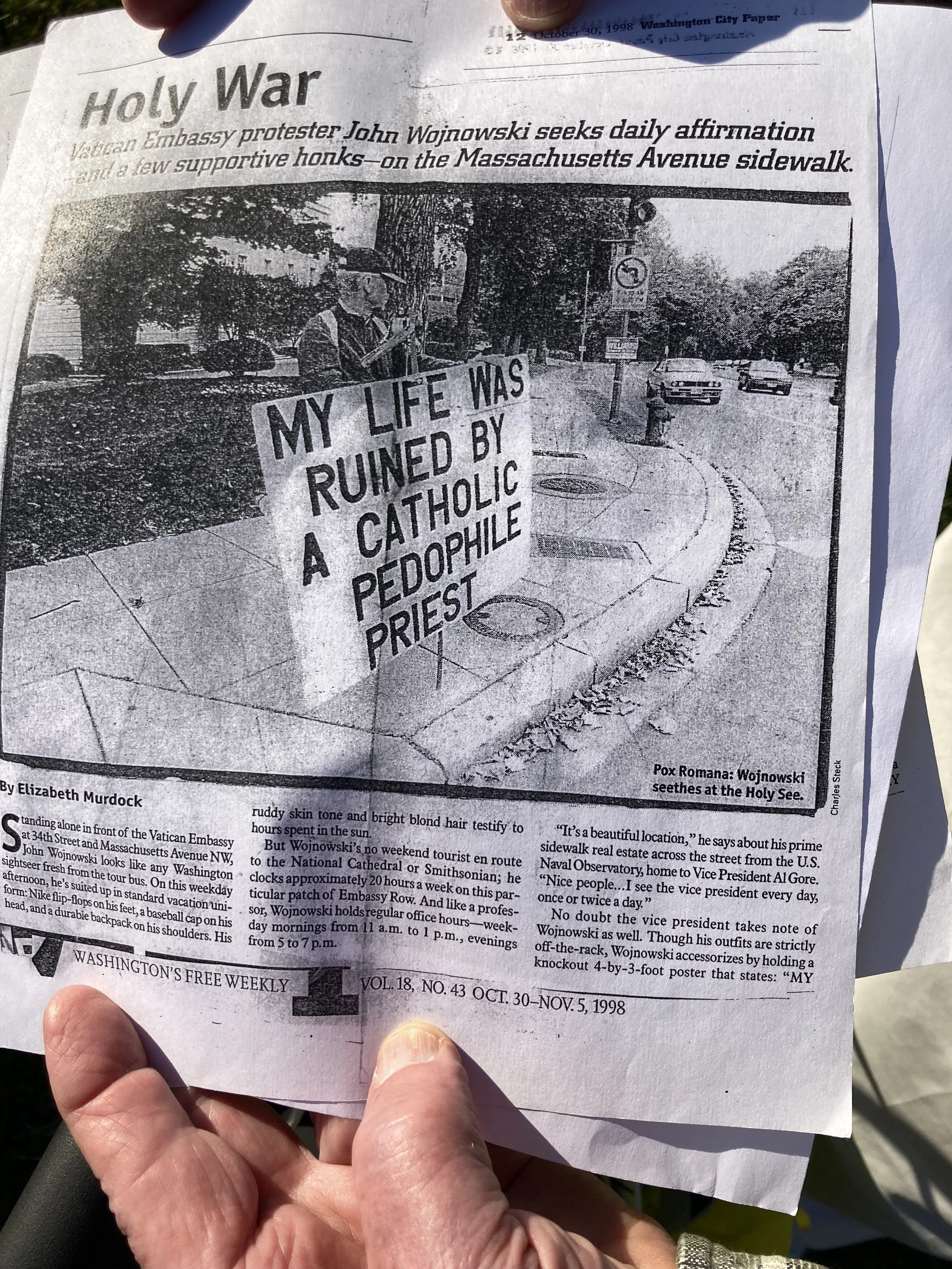 John Wojnowski carries with him a copy of the Washington City Paper article, published in 1998, that he says used his name and photo without permission. Photo by Molly McCluskey.