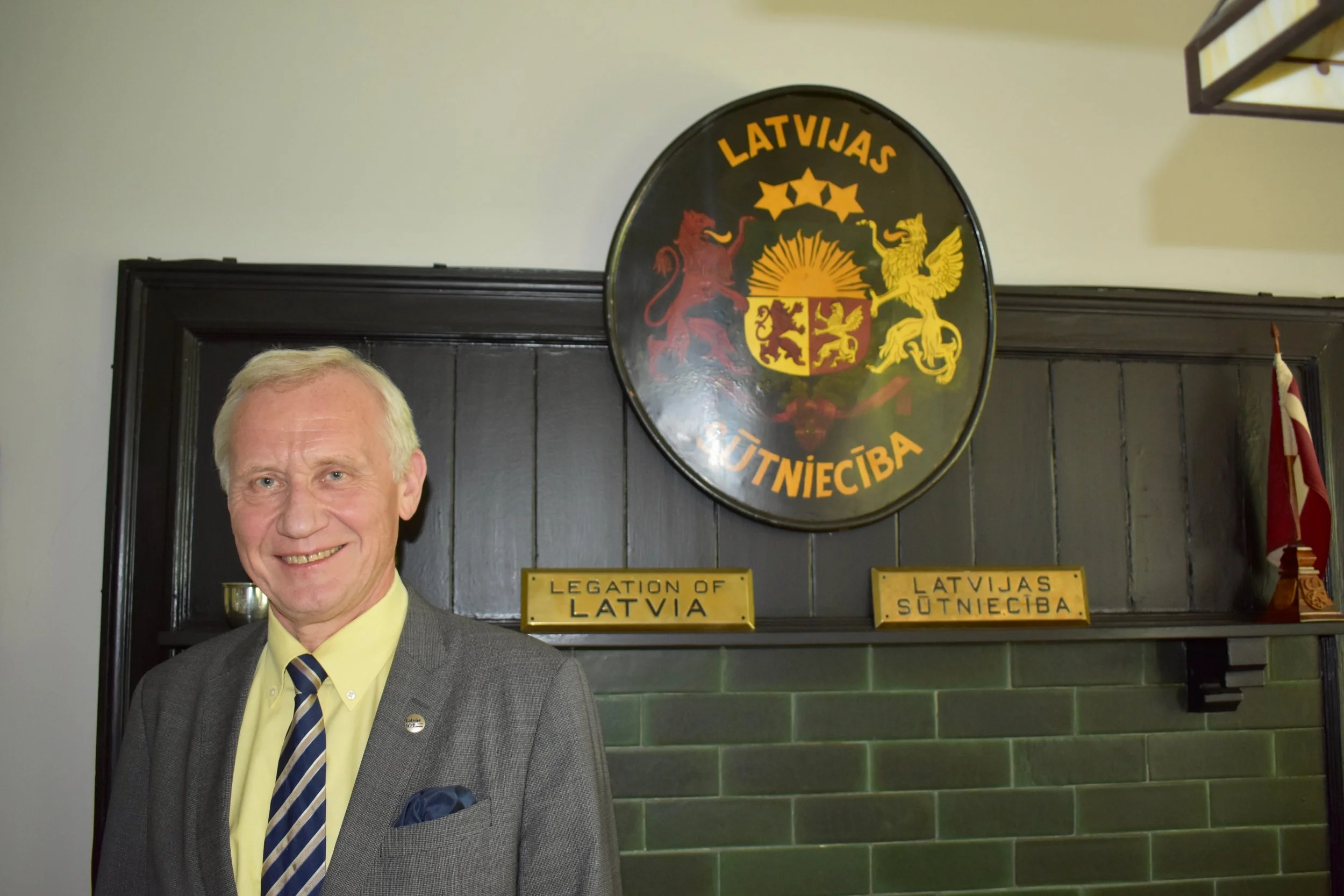 During a tour of the embassy in 2018, then-Ambassador Teikmanis showed the seal that has hung in every Latvian legation in Washington since 1922. Photo by Diplomatica Global Media.
