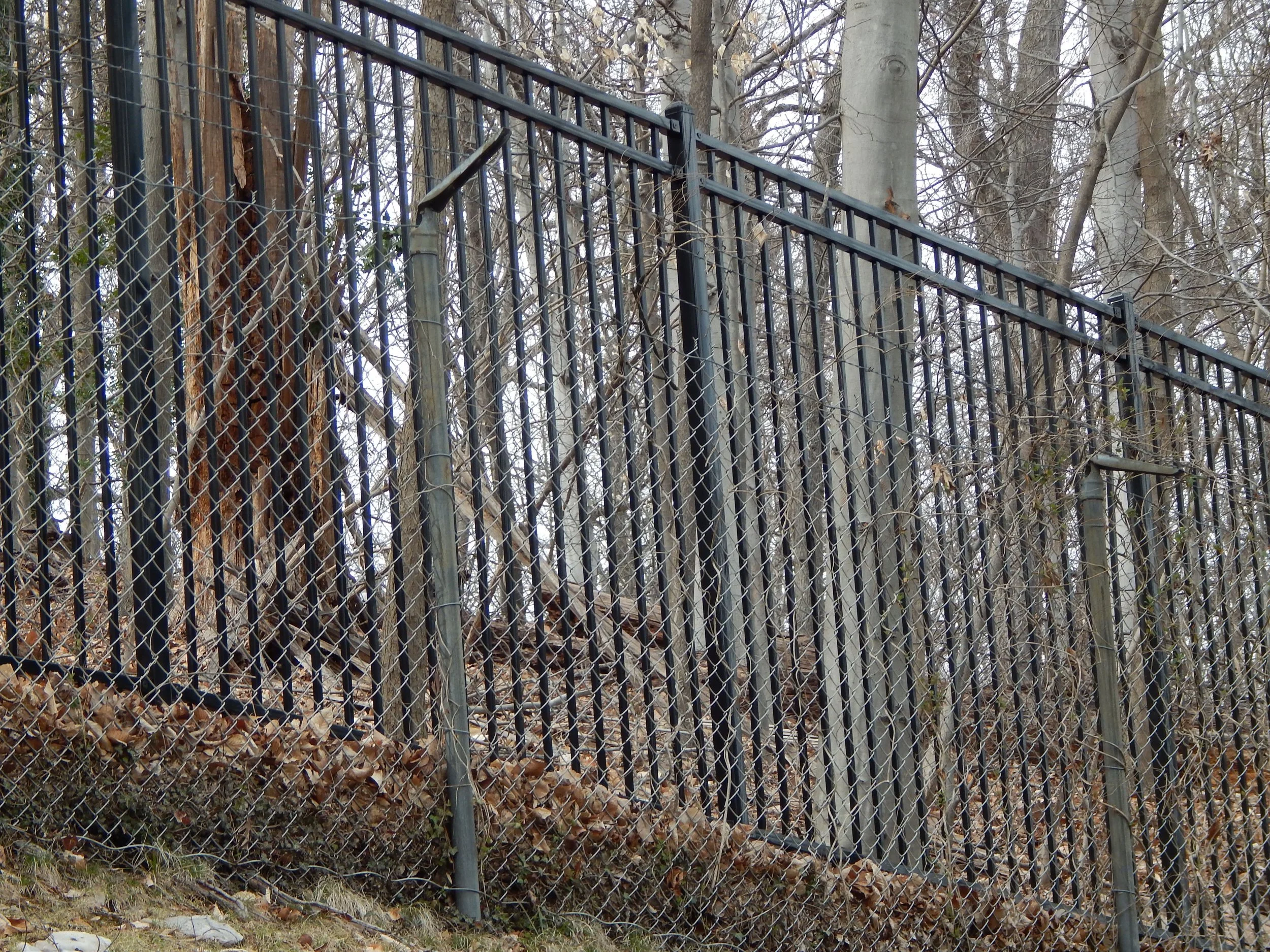 Remants of an old fence designed to keep embassy staff from escaping from the Czech Embassy on Tilden St. Photo by Molly McCluskey.