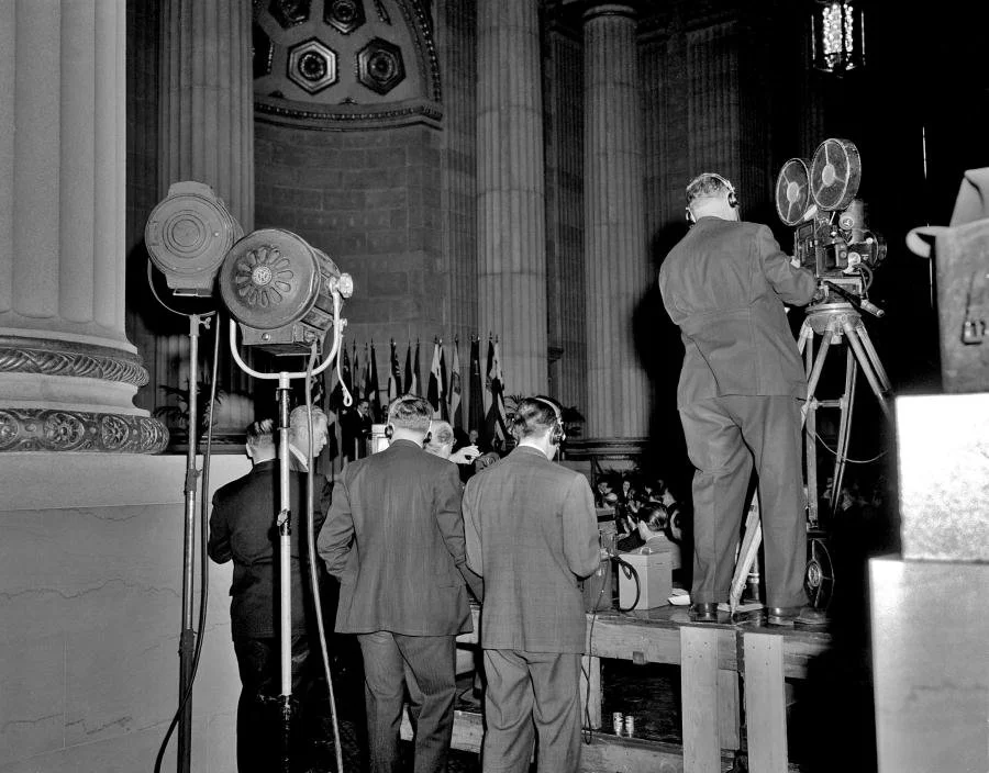 Journalists capture the moment of the signing of the UN charter. Photo courtesy of the United Nations.